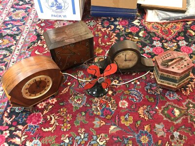 Three vintage wooden mantle clocks, a vintage Westinghouse fan and a squeeze box .