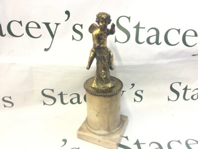 A gilt mounted putti on a marble base, 28cm tall