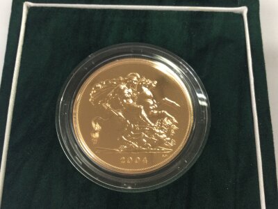 A 2004 uncirculated £5 gold sovereign with box and COA