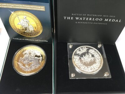 A cased Waterloo medal and the first super crown sized Britannia.