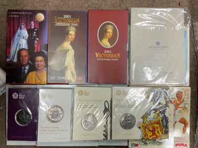 A selection of British uncirculated coin sets.