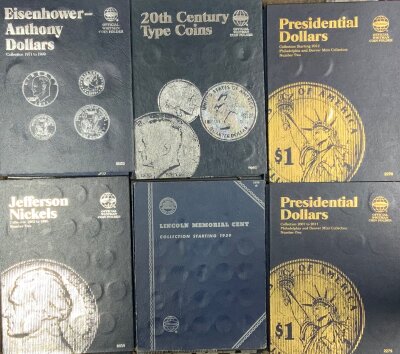 A case of American Whitman and Harris and Co coin folders (some partially complete).