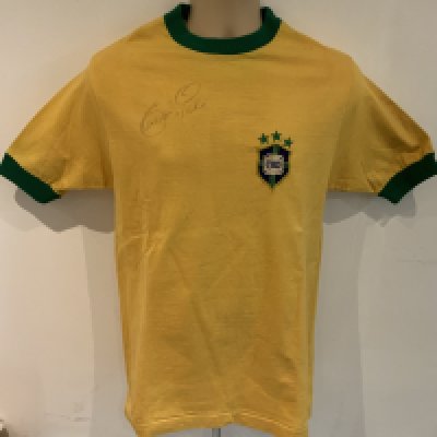 Pele 1971 Signed ( Match Worn ) Brazil Shirt: Yellow number 10 shirt sleeve shirt signed with Peles full signature to front. Made by Athleta. Label stitching on number badge and autograph look original. COA from source in Brazil which states this came from the masseur. Photo identification of original seller from Brazil. We have asked an expert at gamewornfootballshirts and whilst the shirt is original and has all the credentials to be a shirt from that period they inform me even with this paperwork they do not ever accept coas from South America and the seller from Brazil has sold previously similar items for tens of thousands. For that reason this shirt is to be sold by us as a signed original shirt from the period only and not match worn.