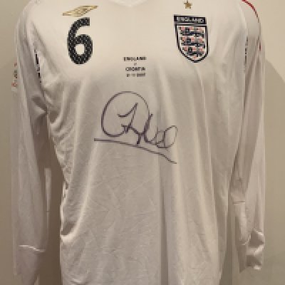 2007 England Match Worn Signed Football Shirt: White long sleeve number 6 Umbro shirt worn by Sol Campbell v Croatia on 21 November 2007 in World Cup qualifier. Good condition and signed to front by the player.