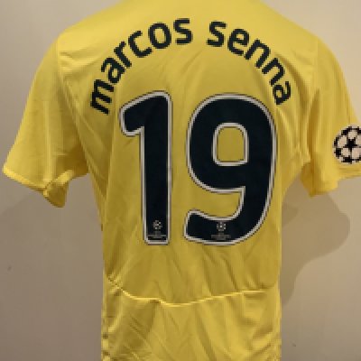 Villarreal Match Worn Football Shirt: Yellow short sleeve number 19 Puma shirt worn by Marcos Senna. Good condition with Champions League badge to right sleeve and Champions League detail to numbers.