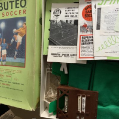 Subbuteto Football Game + Teams: Table soccer game Continental Edition which has paperwork scoreboard goals team names pitches players etc. No full teams so not complete. C/W 6 complete teams. Boxes have writing.