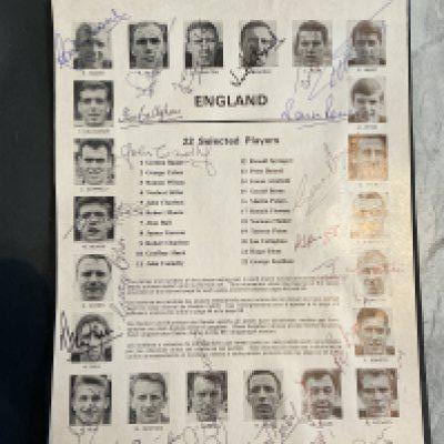 England 1966 World Cup Squad Fully Signed Programme Page: Removed from tournament programme page 29. Pictures all 22 of the England team and hand signed in biro by everyone of them including Bobby Moore and Bobby Charlton. Stunning item laid down to black card.