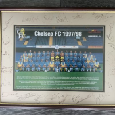 Chelsea 97/98 Framed Signed Football Photo: 21 autographs on a mount with picture of the team and the FA Cup sitting proudly at the front. Autographs include Le Saux Di Matteo and first team coach Graham Rix. Frame measures 22 x 17 inches.