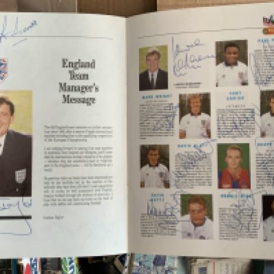 England Fully Signed 1991 Tour Football Memorabilia: Malaysia v England with pen picture of both squads. Each of the 25 have hand signed in correct position which include manager Taylor and assistant McMenemy. Not pictured is goalkeeping coach Bonetti but he has also signed. C/W tour wrap around and programmes v Australia and New Zealand.