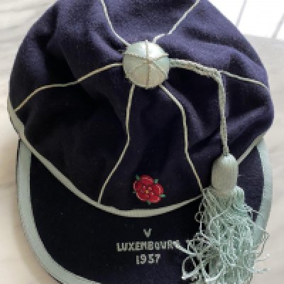 1957 John Lyalls England Youth Cap: Stunning cap in original box awarded to Lyall for playing v Luxembourg. This lot comes with a letter from the FA letting him know of his call up and the acceptance from him. Also included is a photo of Lyall aged 17 when he signed his professional contract which is signed Best Wishes John Lyall.