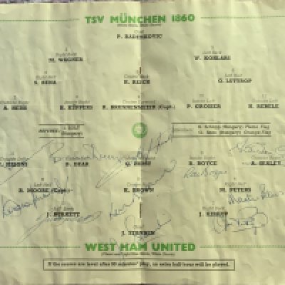 Ron Boyce West Ham Signed European Cup Winners Programme: Official 1965 programme signed to centre page by the team that won West Hams first European trophy. Signatures include Moore, Peters and Hurst as well as Boyce, Dear, Burkett and many more. Programme shows signs of water damage throughout and is in poor condition but signatures and centre page are not affected.
