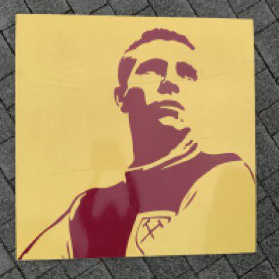 Bobby Moore Large Display From Upton Park. Removed from the Boleyn Ground after its close in 2016. Very large claret and yellow art display featuring Bobby Moore in West Ham kit. Measures approximately 39 inches each side. Not for posting.