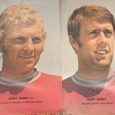 Coffer Early 1970s Football Posters: Posters of Bobby Moore George Best and a West Ham team group. Includes a signed Geoff Hurst. Creases and evidence of pinning to corners. (4)