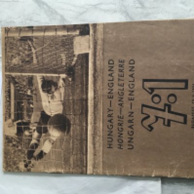 1954 Hungary v England Football Magazine: Hungarian Bulletin magazine with all 24 pages featuring photos of the incredible 7-1 victory over England. Not to be confused with programme this is a blow by blow guide from teams entering the field to line ups, captains shaking hands goals etc. Excellently produced just after the match with captions in Hungarian and English.