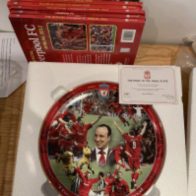 Liverpool Football Memorabilia: Large Danbury Mint plate from 2005 named The Road To The Final, Annuals, Breedon Complete Record book, Bed spread, Bar towels, Shankly plate, Scarves, Pennants, Programmes a few 70s tickets and more. Instructions to sell. (2 boxes)