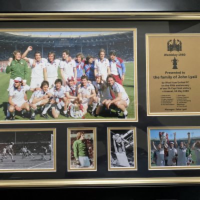 West Ham 1980 FA Cup Final Display Club Gift: Stunning framed gift with pictures of the team celebrating. The plaque reads presented to the family of John Lyall by West Ham United on the 40th anniversary of our FA Cup victory v Arsenal 10 May 1980 with the players names. Whilst a lovely item it has never been on display as the family were disappointed that John was not pictured.