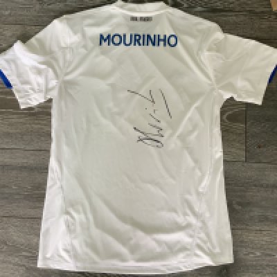 Mourinho Real Madrid 2010 - 2011 Signed Football Shirt: White large home shirt with Mourinho name to rear where he has hand signed clearly without dedication in his first season at the club. From reputable source.