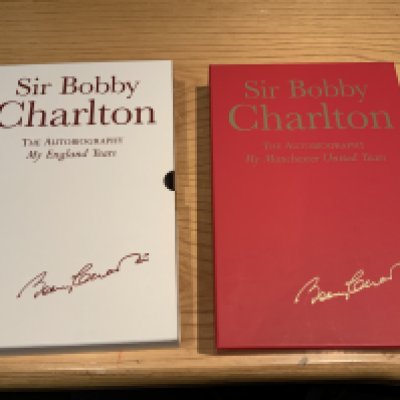 Bobby Charlton Signed Manchester United + England Football Books: My England Years and My Manchester United Years hardback Ltd edition books with dust jackets and slip cases. Excellent condition both signed without dedication. (2)
