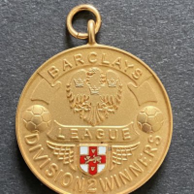 John Lyalls Ipswich Town 91/92 League Division Two Winners Medal: 9ct gold Vaughtons + Sons medal in original box awarded to manager John Lyall. Front reads Barclays League Division Two Winners the reverse stating Season 1991-92. Last ever season of the Football League after 93 seasons where these lovely gold medals were awarded. Ipswich were to start the season in the first season of the Premier League. This is the same medal as the players received. COA from family.