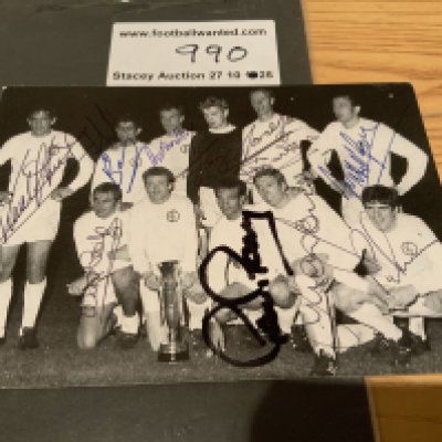 Leeds United 1968 Fairs Cup Winners Signed Postcard: Pictured on the pitch with the cup is all eleven winning players. Everyone hand signed without dedication except Bremner.