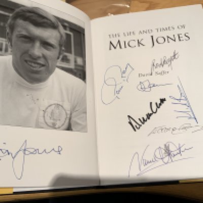 Mick Jones Leeds United Multi Signed Football Book: Excellent hardback book with dust jacket signed on one page by Mick and on the next by team mates Hunter Gray Clarke Reaney Harvey Belfitt Bates Jones and author Saffer. COA from well known reputable source.
