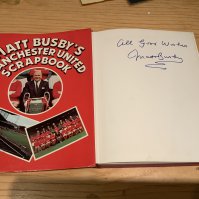 Matt Busby Manchester United Signed Football Book: Hardback book with dust jacket titled Matt Busbys Manchester United Scrapbook in excellent condition. Hand signed All Good Wishes without dedication.