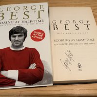George Best Signed Manchester United Football Book: Scoring At Half Time hardback book with dust jacket. Excellent condition signed without dedication.