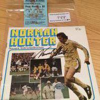 Norman Hunter Leeds United Signed Testimonial Brochure + More: Brochure from 1975 is clearly signed without dedication to cover. C//W ticket for his testimonial match v a Don Revie X1. (2)