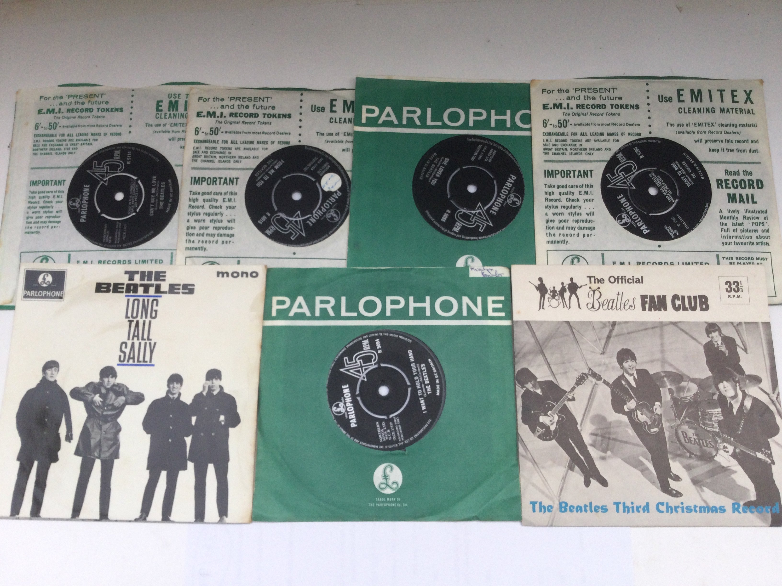 A collection of 7inch singles and EPs by The Beatles including a 'Third Christmas Record' fan club flexi disc.