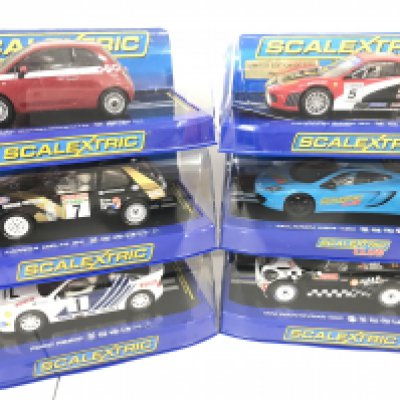 6 Boxed Scalextric Cars. A Fiat Cinquecento. A Ferrari F430 GT. A Lancia Delta S4. A McLaren MP4-12c. A Ford Rs200 and a Mini Countryman WRC.