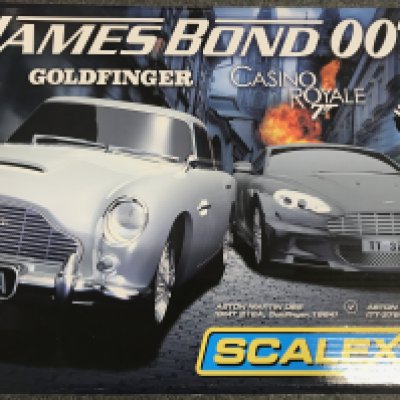 A Boxed Scalextric James Bond Goldfinger/ Casino Royal Set. Outer Box is Worn. Sealed inside.