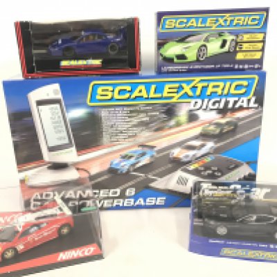 3 X Boxed Scalextric Cars. A Boxed Ninco Cars and a Scalextric Advanced 6 Car Powerbase. (2).
