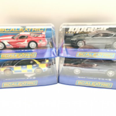 4 X Boxed Scalextric Cars. A Dodge Viper. A Aston Martin DBS. A Subaru Impreza. An a Ford GT.