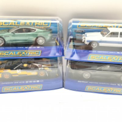 4 Boxed Scalextric Cars. 2 Aston Martins DB5. A Ferrari 308 GTB and a Ford Escort MK1.
