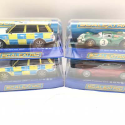 4 x Boxed Scalextric Cars 2 X Range Rover Police Cars. A Ferrari 330 P4 and a Aston Martin DB5.