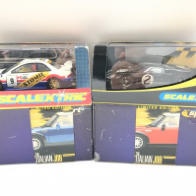 4 X Boxed Scalextric Cars. Including 2 Italian Job Minis. A Subaru Impreza and a Ford GT MK II.