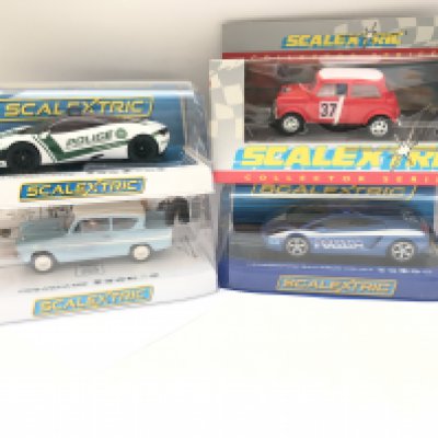 4 X Boxed Scalextric Cars. A McLaren 720s Police Car. A Harry Potter Ford Anglia 105E. A Mini Cooper and a Lamborghini Gallardo Police Car.