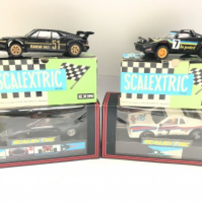 4 X Boxed Scalextric Cars including a Spanish BMW M1. A Spanish Lancia S. Le Point. A Martini Lancia and a Ferrari F40.