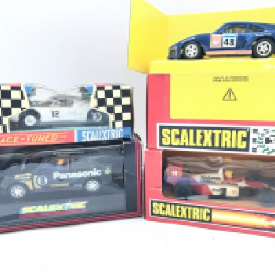 4 X Boxed Scalextric Cars. A Ford GT. A Ford Escort Cosworth. A Porsche 935 and a NcLaren F1.