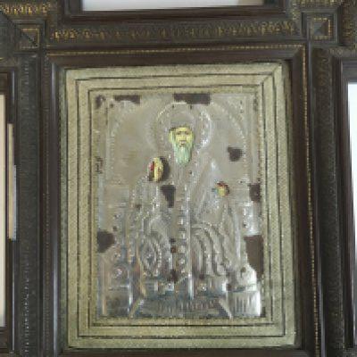 A Russian Icon on wood with a silver background . frame size 40x46cm.