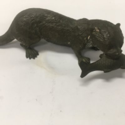 A cast bronze figure in the form of a otter with fish in mouth . 16 cm .NO RESERVE