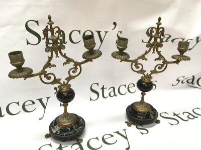 A pair of marble candelabras, 30cm tall 22cm wide