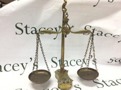A 19th century brass set of small beam scales with seven original weights, 37Cm tall.