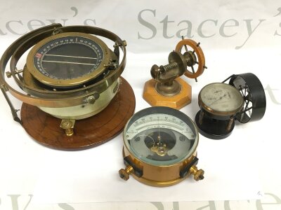 A nautical compass and other instruments.