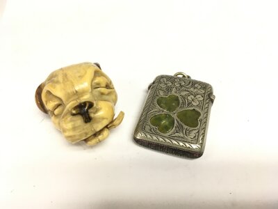 A Bonzo character novelty tape measure and a Vesta case (2).