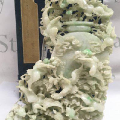 An impressive 20th century Apple Green dye Jade lidded pot surrounded by cranes and other animals, with box. Approximately 25cm tall 16cm wide .