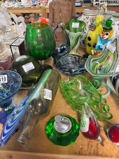 A collection of Murano glass vases fish a clown vases and a ship in a bottle and other ceramics.