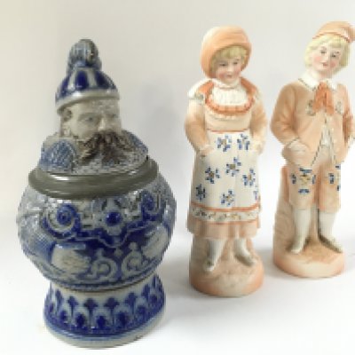 A German stoneware cobalt blue character stein and pair of German classical figures . Approximately 21cm tall.- NO RESERVE