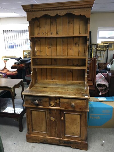 A pine dresser 204cm tall, 95cm wide, 55cm long.