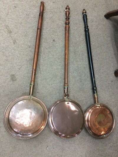Three copper bed pans